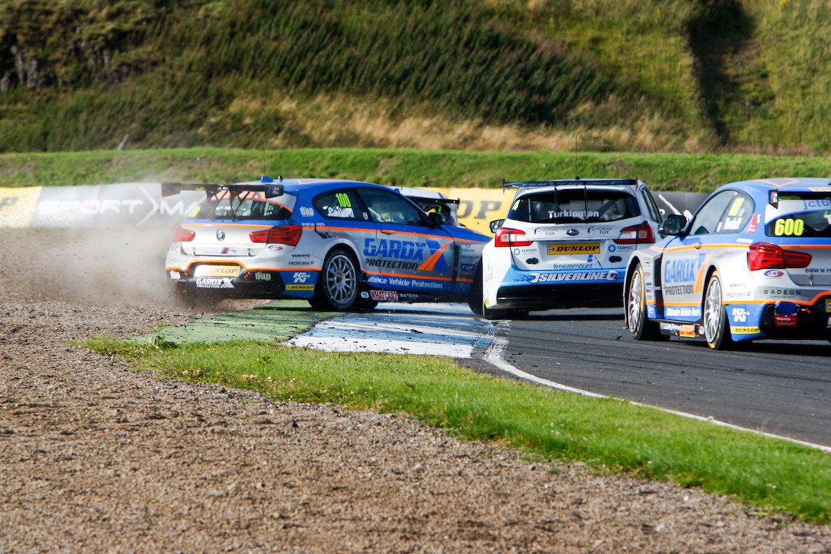 Robert Collard (GBR) No.100 Team JCT600 With GardX BMW 125i M Sport & Colin Turkington (GBR) No.4 Subaru Team BMR Subaru Levorg GT in the British Touring Car Championship Race 3 at Knockhill,Fife,UK on 14 August 2016. Lanyon/PSP Images